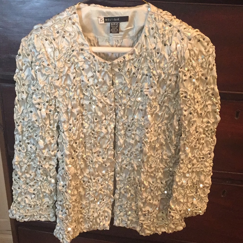 Light weight jacket with sequins.